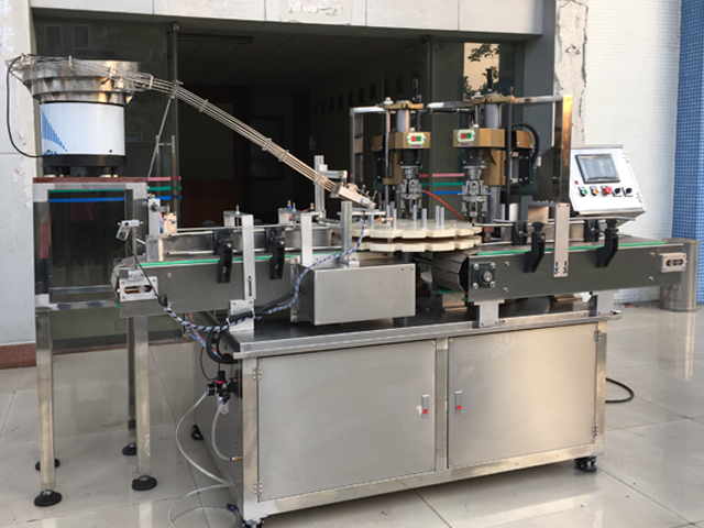 capping machine with 2 capping heads skruelåg udstyr semi automatic.jpg